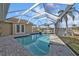 Enjoy a private swimming pool with beautiful water views in a screened enclosure, offering a perfect blend of relaxation at 1303 Casey Key Dr, Punta Gorda, FL 33950