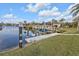 View of waterfront and boat lift system providing direct access to the water at 1303 Casey Key Dr, Punta Gorda, FL 33950