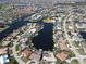 Stunning aerial view of waterfront homes along canals in a charming community with lush landscaping and boating opportunities at 1407 Waxwing Ct, Punta Gorda, FL 33950