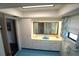 Well-lit bathroom with ample counter space, storage cabinets, and a walk-in shower at 1407 Waxwing Ct, Punta Gorda, FL 33950