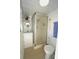Cozy bathroom featuring a shower, sink, and toilet in a compact layout at 1407 Waxwing Ct, Punta Gorda, FL 33950