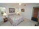Cozy bedroom with neutral carpet, two windows and soft, natural light at 1407 Waxwing Ct, Punta Gorda, FL 33950