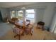 Sunny dining area with table and four chairs with water view at 1407 Waxwing Ct, Punta Gorda, FL 33950