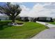 Beautiful one-story home with a stone accent wall, tidy landscaping, and a spacious green lawn at 1407 Waxwing Ct, Punta Gorda, FL 33950