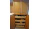 Kitchen pantry with pull out shelves, maximizing storage space and organization at 1407 Waxwing Ct, Punta Gorda, FL 33950