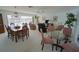 Open living room with dining area features waterfront views and neutral decor at 1407 Waxwing Ct, Punta Gorda, FL 33950
