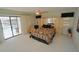 Bedroom featuring ceiling fan, closet, and sliding glass doors to the outside pool at 1407 Waxwing Ct, Punta Gorda, FL 33950