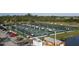 Aerial view of outdoor pickleball courts featuring many fenced courts, players, and a parking lot at 1407 Waxwing Ct, Punta Gorda, FL 33950