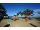 Community playground featuring geometric climbing structures, slides, and nearby seating at 1407 Waxwing Ct, Punta Gorda, FL 33950