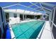 Screened-in pool and patio area offers abundant seating and plenty of sunshine at 1407 Waxwing Ct, Punta Gorda, FL 33950