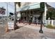 Inviting restaurant exterior with outdoor seating, striped awning, and signage promoting Cuban cuisine in Punta Gorda at 1407 Waxwing Ct, Punta Gorda, FL 33950
