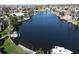 Scenic waterfront view with a private dock, perfect for boating and enjoying the tranquil water, with lush greenery around the house at 1407 Waxwing Ct, Punta Gorda, FL 33950