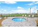 Community hot tub with views of the golf course and lounge chairs to relax and enjoy the day at 14071 Heritage Landing Blvd # 325, Punta Gorda, FL 33955