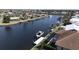 Beautiful waterfront home with a private dock, lift, and easy access to the open water at 1492 Aqui Esta Dr, Punta Gorda, FL 33950
