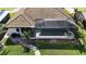 Aerial view of a home with a pool, a lanai, manicured landscaping, and a walking path at 1492 Aqui Esta Dr, Punta Gorda, FL 33950