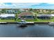 Aerial view of waterfront property with boat dock and expansive water access at 1492 Aqui Esta Dr, Punta Gorda, FL 33950