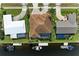 Aerial view of waterfront home with boat dock, lush landscaping, and serene water views at 1492 Aqui Esta Dr, Punta Gorda, FL 33950