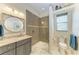 Clean bathroom featuring a vanity sink, walk in shower, and toilet at 1492 Aqui Esta Dr, Punta Gorda, FL 33950