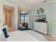 Relaxing bedroom features a serene view and a comfortable seating area at 1492 Aqui Esta Dr, Punta Gorda, FL 33950