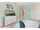 Bedroom featuring a TV and a large dresser for ample storage space at 1492 Aqui Esta Dr, Punta Gorda, FL 33950