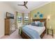 Cozy bedroom with large bed, detailed wooden furniture, and bay window at 1492 Aqui Esta Dr, Punta Gorda, FL 33950