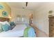 Well lit bedroom with large bed, detailed wooden furniture, and closet space at 1492 Aqui Esta Dr, Punta Gorda, FL 33950