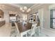 The dining room connects seamlessly with the living room and a modern, eat-in kitchen space at 1492 Aqui Esta Dr, Punta Gorda, FL 33950
