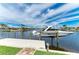 Boat dock and lift offering direct access to the beautiful waterfront at 1492 Aqui Esta Dr, Punta Gorda, FL 33950