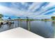 Scenic waterfront view from the dock featuring a boat lift and access to the canal at 1492 Aqui Esta Dr, Punta Gorda, FL 33950