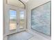 Bright entryway with a decorative frosted glass double-door and tiled floors at 1492 Aqui Esta Dr, Punta Gorda, FL 33950