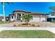 Charming home with a well-maintained lawn, beautiful landscaping, and a three-car garage at 1492 Aqui Esta Dr, Punta Gorda, FL 33950