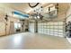 Well-organized garage with multiple parking spaces and overhead storage solutions at 1492 Aqui Esta Dr, Punta Gorda, FL 33950