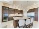 Gourmet kitchen with granite countertops, custom cabinetry, and stainless steel appliances at 1492 Aqui Esta Dr, Punta Gorda, FL 33950