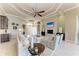 Spacious living room featuring stylish decor, fireplace, and an open floor plan at 1492 Aqui Esta Dr, Punta Gorda, FL 33950