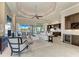 Bright, open-concept living room with elegant furnishings and scenic water views at 1492 Aqui Esta Dr, Punta Gorda, FL 33950