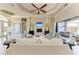 Beautiful living room offering neutral walls, sleek fireplace, and access to screened outdoor space at 1492 Aqui Esta Dr, Punta Gorda, FL 33950