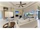Comfortable living room with a fireplace, built-ins and an open-concept floorplan at 1492 Aqui Esta Dr, Punta Gorda, FL 33950