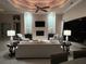 Cozy living room area with plush seating, custom ceiling detail, fireplace and decorative wall accents at 1492 Aqui Esta Dr, Punta Gorda, FL 33950
