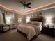 Serene main bedroom with soft lighting, ceiling fan, and stylish decor for optimal comfort at 1492 Aqui Esta Dr, Punta Gorda, FL 33950