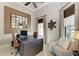 Home office space with large desk, decorative mirror and comfortable sitting area at 1492 Aqui Esta Dr, Punta Gorda, FL 33950