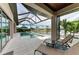 Relaxing pool area with waterfront views, screened enclosure, and comfortable lounge chairs at 1492 Aqui Esta Dr, Punta Gorda, FL 33950