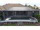 View of the pool area featuring a spa, patio, and an enclosure providing privacy and comfort at 1492 Aqui Esta Dr, Punta Gorda, FL 33950