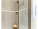 Modern shower featuring stylish gray tile and a seamless glass enclosure at 1492 Aqui Esta Dr, Punta Gorda, FL 33950