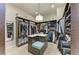 Large walk-in closet featuring custom shelving and storage island with bench seating at 1492 Aqui Esta Dr, Punta Gorda, FL 33950