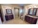 Bathroom with dual vanities, marble countertops, and tile floors at 1492 Kolenda St, Port Charlotte, FL 33952