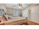 Cozy bedroom featuring a neutral color scheme and a comfortable-looking bed with decorative pillows at 1525 Hinton St, Port Charlotte, FL 33952