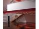 Stairs in the garage leading to a loft area with recessed lights and steel beams at 1525 Hinton St, Port Charlotte, FL 33952