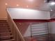Stairs in the garage leading to a loft area with recessed lights and an electric door at 1525 Hinton St, Port Charlotte, FL 33952