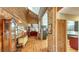 The hallway leads to a bright living room and kitchen, with a unique brick and wood design at 1525 Hinton St, Port Charlotte, FL 33952