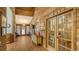 Hallway showcasing unique wood paneling, brick accents, and views into multiple living spaces at 1525 Hinton St, Port Charlotte, FL 33952